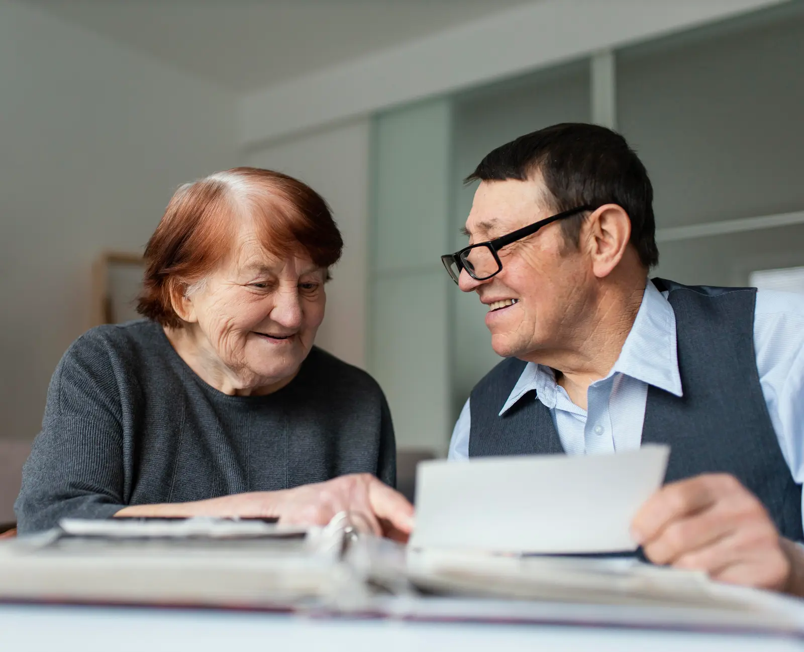 elder couple looking over law documents